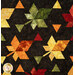 A closer look at the pieced leaves and triangles of the quilt, demonstrating the patchwork layout of the quilt.