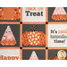 A close up on the center of the quilt, showcasing the combination of pieced and appliqué blocks in festive orange, white, black, and pink fabrics.