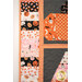 A super close up on the pieced border, showcasing the Halloween themed fabrics colored in black, white, pink, and orange.