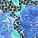 Very light blue fabric with blue and brilliant yellow roses on a black floral background.