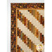 A close up on the upper left corner of the quilt, demonstrating details on the inner and outer border fabrics.