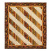 The completed 28th Floor quilt, colored in bold neutral tones like cream, brown, red, and gold, isolated on a white background.