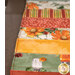 A super close up on the patchwork of the project demonstrating color and print details.