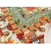 An angled shot of the log cabin patchwork of the runner, demonstrating vibrant fabric colors and prints as well as top quilting details.