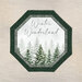 Mockup of a completed panel table topper in green and white fabrics in a winter theme.