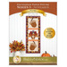Front cover of the Foundation Paper Piecing Series 3 - November Pattern showing the completed wall hanging, hung on a white wall and staged with coordinating fall decor.