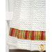 A super close up on the bottom of the hanging towel, demonstrating fabric colors and print details on the striped fabric strip running through the bottom.