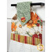 An angled shot of the top of the hanging towel, demonstrating fabric colors and details on the fabric button.