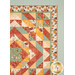 A closer look at the quilt, demonstrating fabric layout as well as prints and colors.