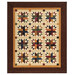 The completed Woven Dreams quilt colored in warm brown, gold, and cream primitive fabrics from the Wheatland collection by Moda Fabrics, isolated on a white background.