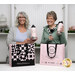 Two smiling models (Lynn & Tammy) model the water bottles with the matching pink tote bags.
