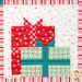 A head-on close up on one of the blocks featuring presents, demonstrating details on the aqua and bright red fabrics.