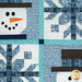 A close up on the center of the project, showing fabric details on the snowflakes, snowmen, and sashing.