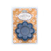 A denim blue flower-shaped magnetic dish with a central indentation.
