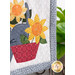 A super close up on the yellow appliqué flowers, demonstrating fabric colors and details.