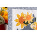 A super close up on the yellow appliqué flowers, demonstrating fabric colors and details.