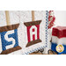 A super close up on two of the lettered spools of the project that spell out 