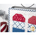 A super close up on the patchwork of the popicles, demonstrating fabric colors and top quilting details.