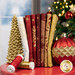 A stack of the fabrics included in the O' Christmas Tree - Red collection, with trees and lights and ornaments and a window and snow thread.