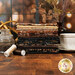 A stack of fabrics included in the Coffee Shoppe collection with a window and a plant and a coffee cup and coffee beans and thread.