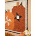 A close up on the rightmost pumpkin, showcasing the pinwheel and fabric details.