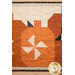 A close up on the middle pumpkin, showcasing the pinwheel and fabric details.