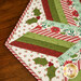 A stylized shot of half the table topper, staged on a wooden tabletop.