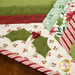 A super close up on one of the holly leaves, showcasing the embellishments and appliqué shapes.
