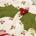 A super close up on one of the holly leaves, showcasing the embellishments and appliqué shapes.