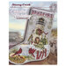 Front of the cross stitch pattern showing the completed Coastal Holiday Lighthouse stocking with a coastal background.