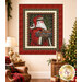 The completed Santa quilt above a cozy holiday-decorated living room scene.
