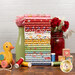 A stack of the fabrics included in the Dear Sweetheart collection, staged with a jar and a vase and flowers and toy blocks and a pully duck and thread.