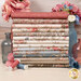 A stack of the fabrics included in the Meadow Blush Fat Quarter Bundle, with jars and flowers and vases and thread.