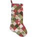 The completed Fast Fusible Patchwork Stocking colored in the Berry & Pine collection by Moda Fabrics, isolated on a white background.