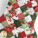 A super close up view of the patchwork, showing the A Vintage Christmas fabric details.