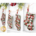 The four completed Fast Fusible Patchwork Stockings colored in the Berry & Pine collection from Moda Fabrics, hung on a string by clothespins in front of white wooden decor with Christmas garland at the top.