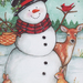 an 8x8 swatch of the panel featuring a snowman holding a basket surrounded by a cardinal, rabbits, and a deer.