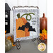 The completed On Wander Lane Mini Quilt for October at a slight angle, showingan appliqué pumpkin and bat beside hand-stitched text that reads 