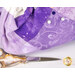 An up close image of the lavender and violet fabrics used in the project and a white and purple pin demonstrating use of the product