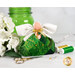 The completed May Birthstone Angel with a rich emerald palette, white wings, a gold bow and vivid green charm beside coordinating decor and notions.