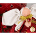 Detail shot of the angel, highlighting the metallic effect of the wings and the angel's metallic gold bow featuring a vivid red charm that resembles a ruby in a golden setting.