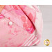 An up close image of the rose pink fabrics used in the project and a pink and white pins demonstrating use of the product