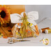 Image of the back of the angel, showing gold ribbons with color coordinated sewing clips