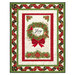 The completed Ribbon Border Panel Quilt colored in red, green, cream, and gold metallic fabrics from the Joyful collection by Timeless Treasures, isolated on a white background.