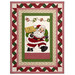 The completed Ribbon Border Panel Quilt colored in red, green, and cream fabrics from the Santa's Coming to Town collection by Henry Glass Fabrics, isolated on a white background.