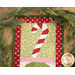 A super close up on the candy cane, showing fabric colors and print details.