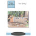 Front of pattern showing a picture of the completed project staged with sewing notions decor.