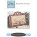 Front of pattern showing a picture of the completed project staged with sewing notions decor.