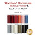 Twelve spools of thread in red, coral, pink, blue, gray, white, and black, isolated on a white background underneath a text graphic that reads "Woodland Snowmies Making Friends - Block of the Month Thread Set."