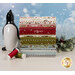 A stack of the fabrics included in the Chilly FQ set, with mistletoe and snow and a penguin and thread.